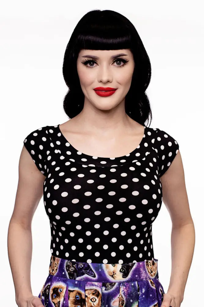 Black and white vintage polka dot cotton top with boat neck and short cap sleeves for casual wear