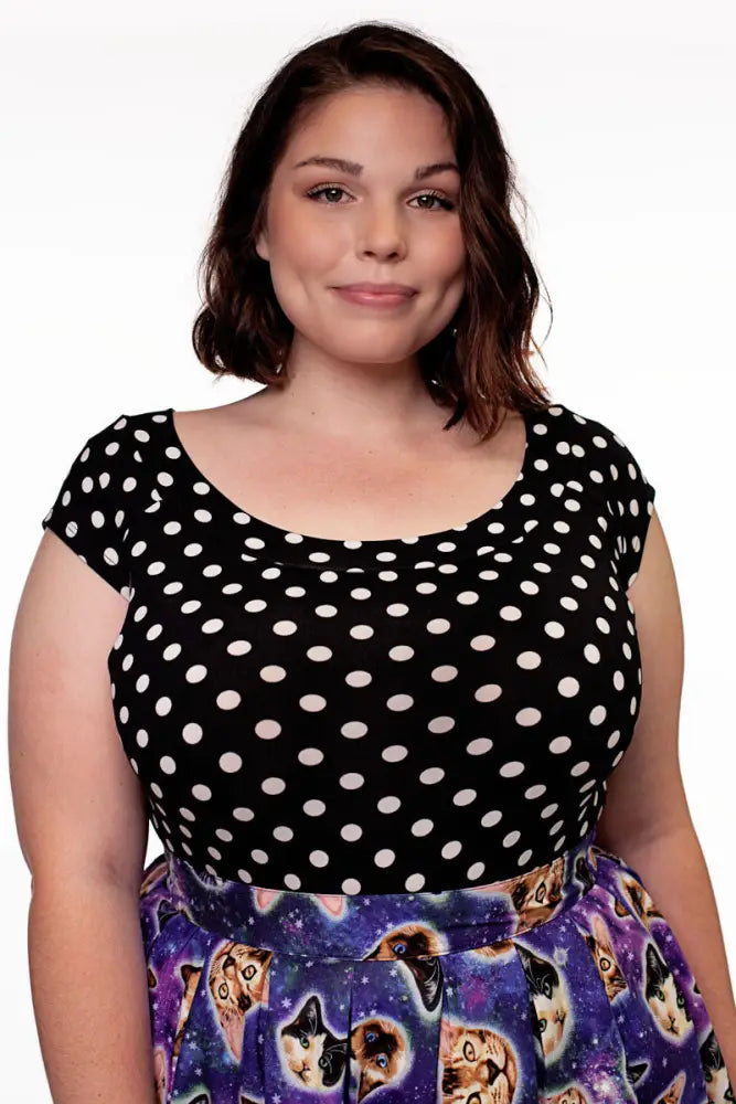 Vintage black and white polka dot boat neck cap sleeve top with short sleeves in lightweight fabric