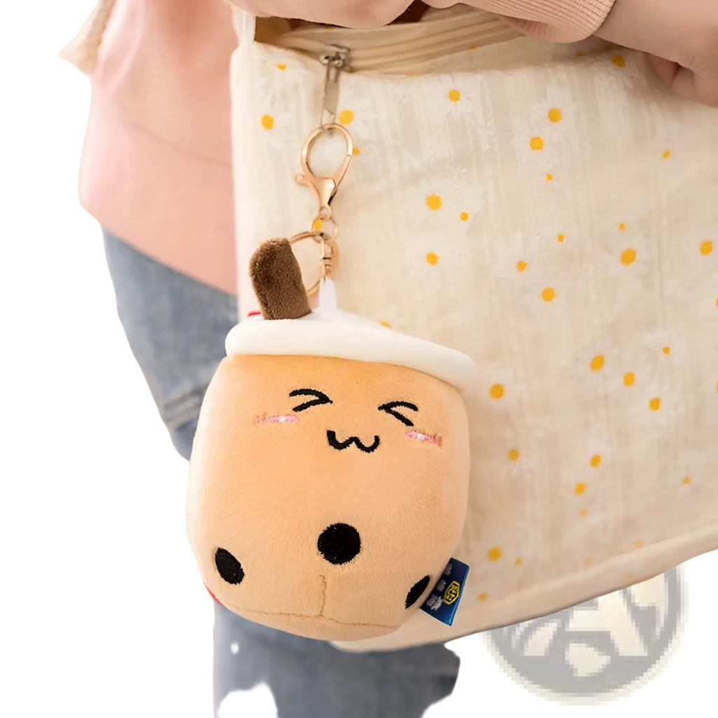 Cute beige plush boba tea cup keychain with black dot details and brown straw for milk tea cup doll pendant