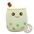 A soft mint-green plush pillow shaped like a kawaii boba tea cup with embroidered eyes and green tapioca pearls