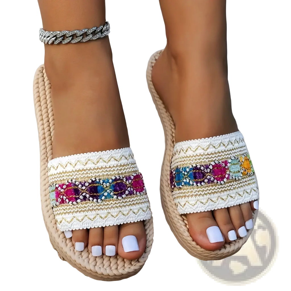 Beige woven espadrille bohemian beaded flat sandals with white embroidered strap and colorful sequined accents