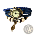 Bohemian blue braided leather wrap watch with ornate bronze-toned case and dangling leaf charm