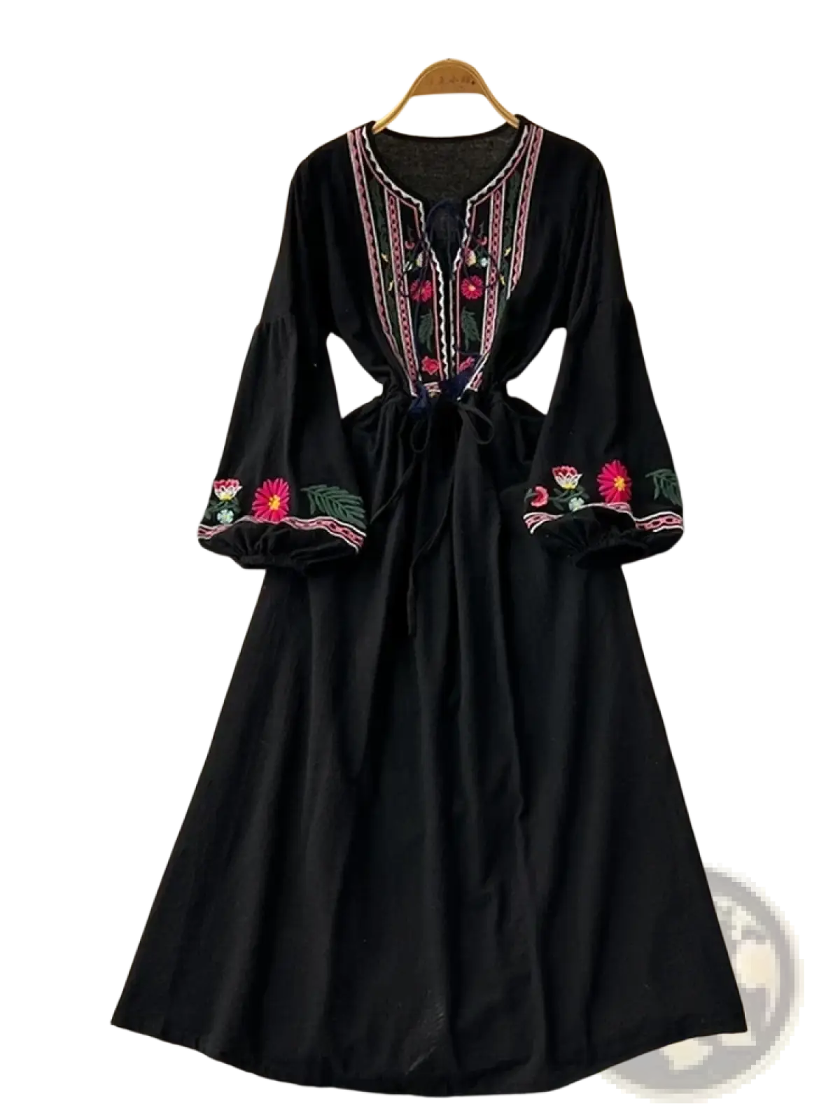 Black bohemian embroidered long sleeve dress with vibrant pink red and green floral embroidery on neckline and cuffs