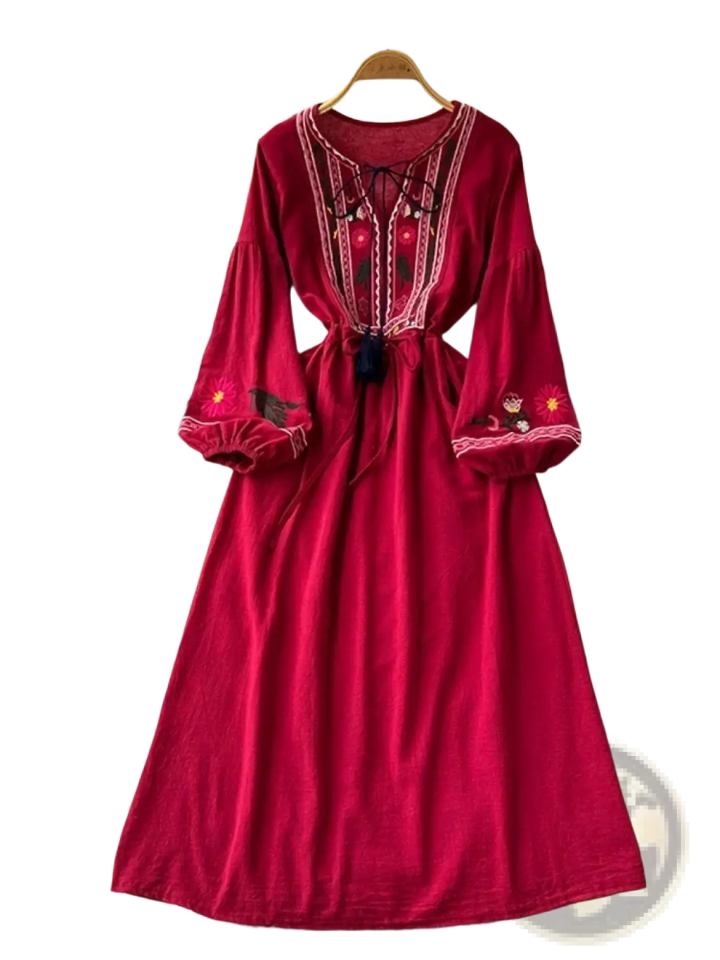 A rich red velvet bohemian embroidered long sleeve maxi dress with white and gold intricate embroidery details