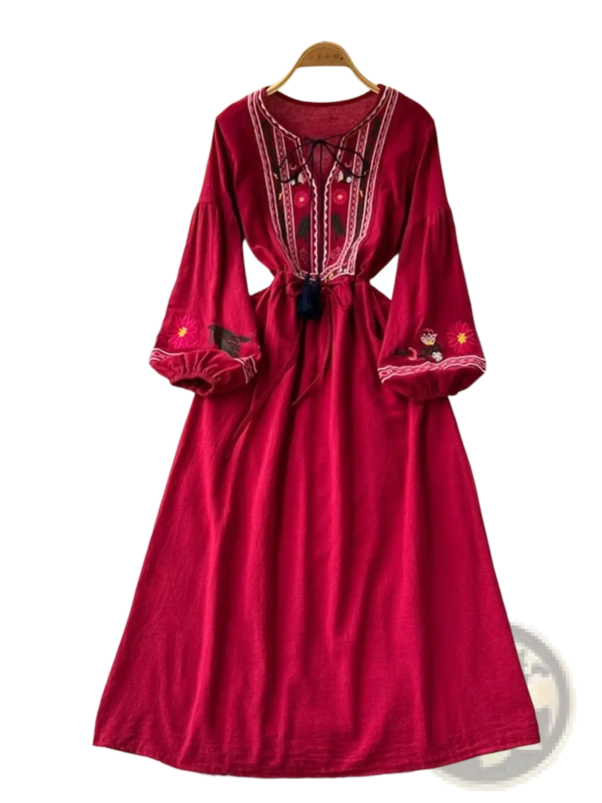 A rich red velvet bohemian embroidered long sleeve maxi dress with white and gold intricate embroidery details