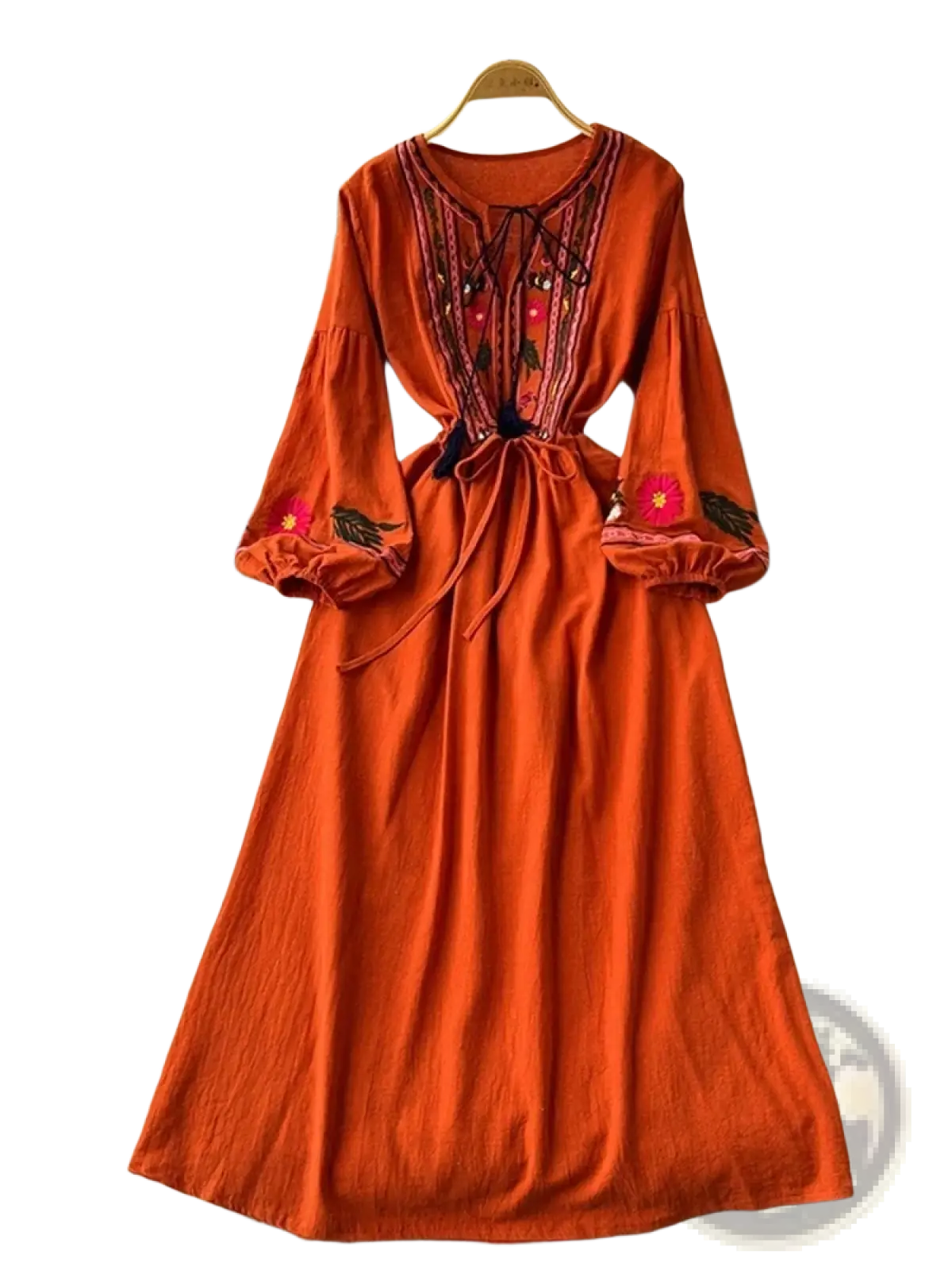 A vibrant orange bohemian embroidered long sleeve dress with floral embroidery and a drawstring waist