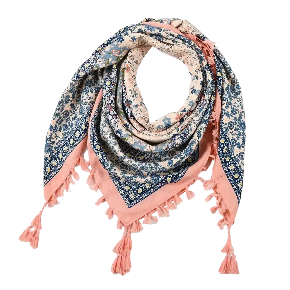 Soft peach-colored bohemian floral square scarf with delicate blue and white floral pattern and matching tassels