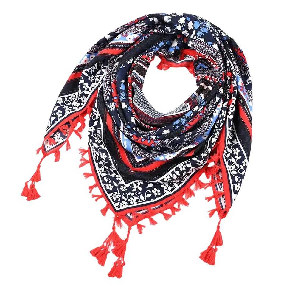 A vibrant red black and white bohemian floral square scarf with tassels suitable as a shawl accessory