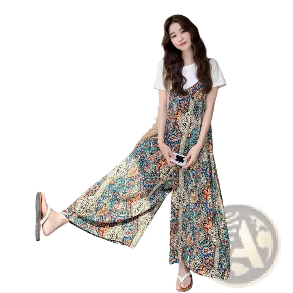 A flowing long-sleeved floral print maxi dress in teal orange and cream tones for bohemian style occasions