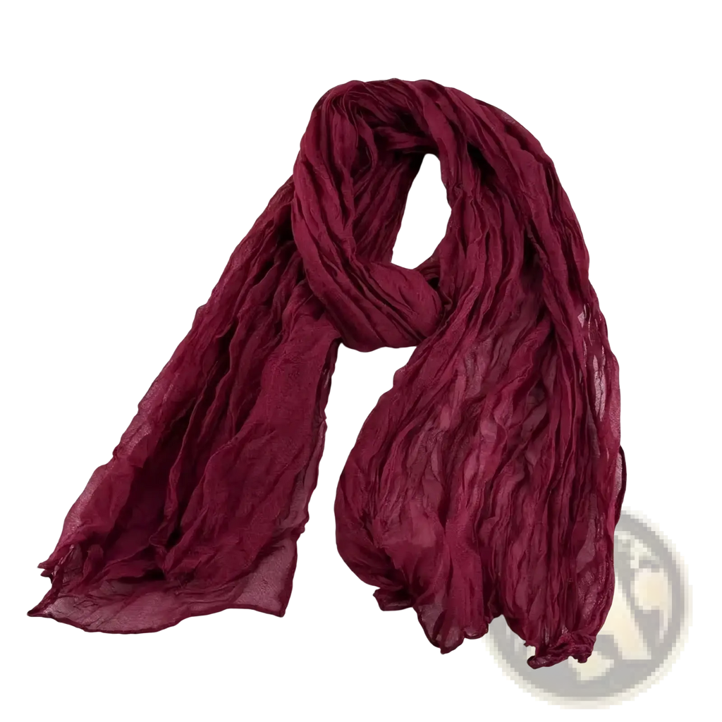 A soft crinkled maroon bohemian pleated cotton linen scarf with lightweight sheer fabric long wrap