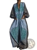 Bohemian printed wide leg pants in faded blue and gray with teal embroidered patterns and flowing long sleeves