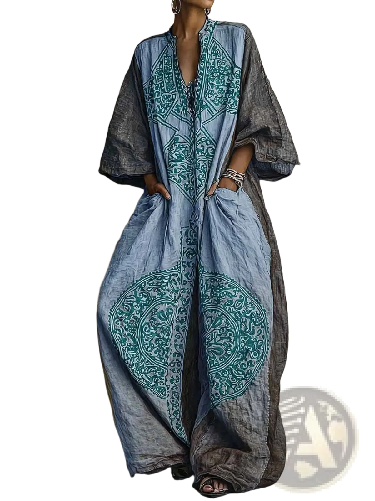 Bohemian printed wide leg pants in faded blue and gray with teal embroidered patterns and flowing long sleeves