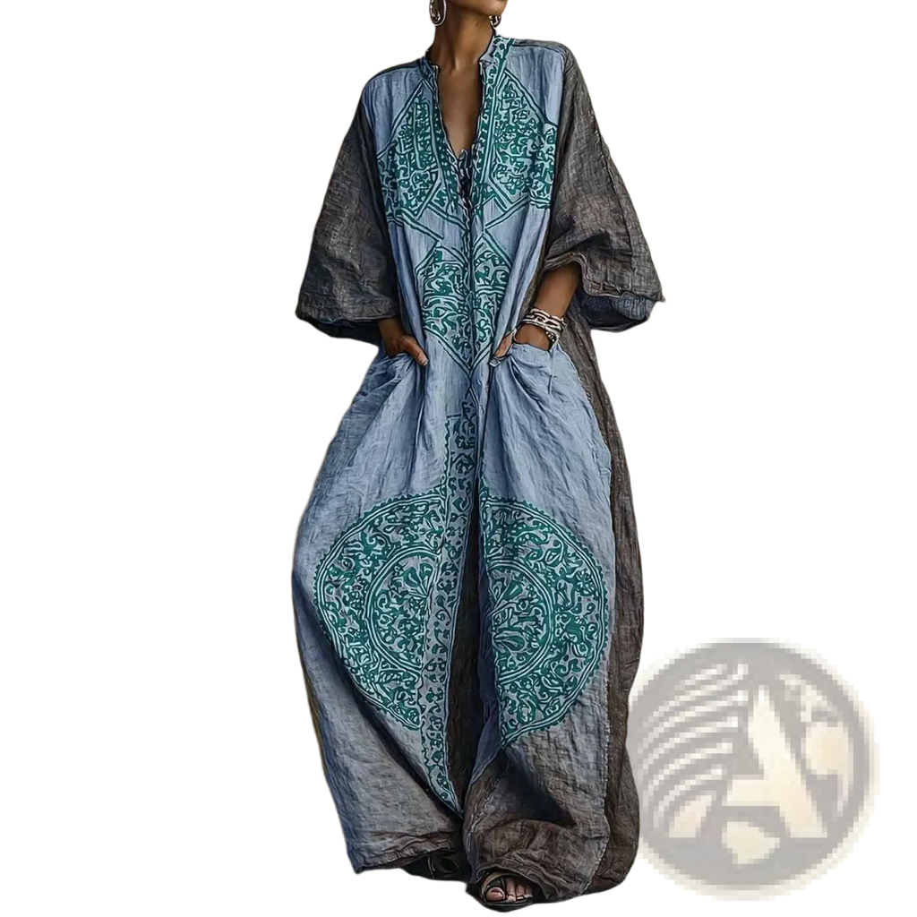 Bohemian printed wide leg pants in faded blue and gray with teal embroidered patterns on flowing long sleeves