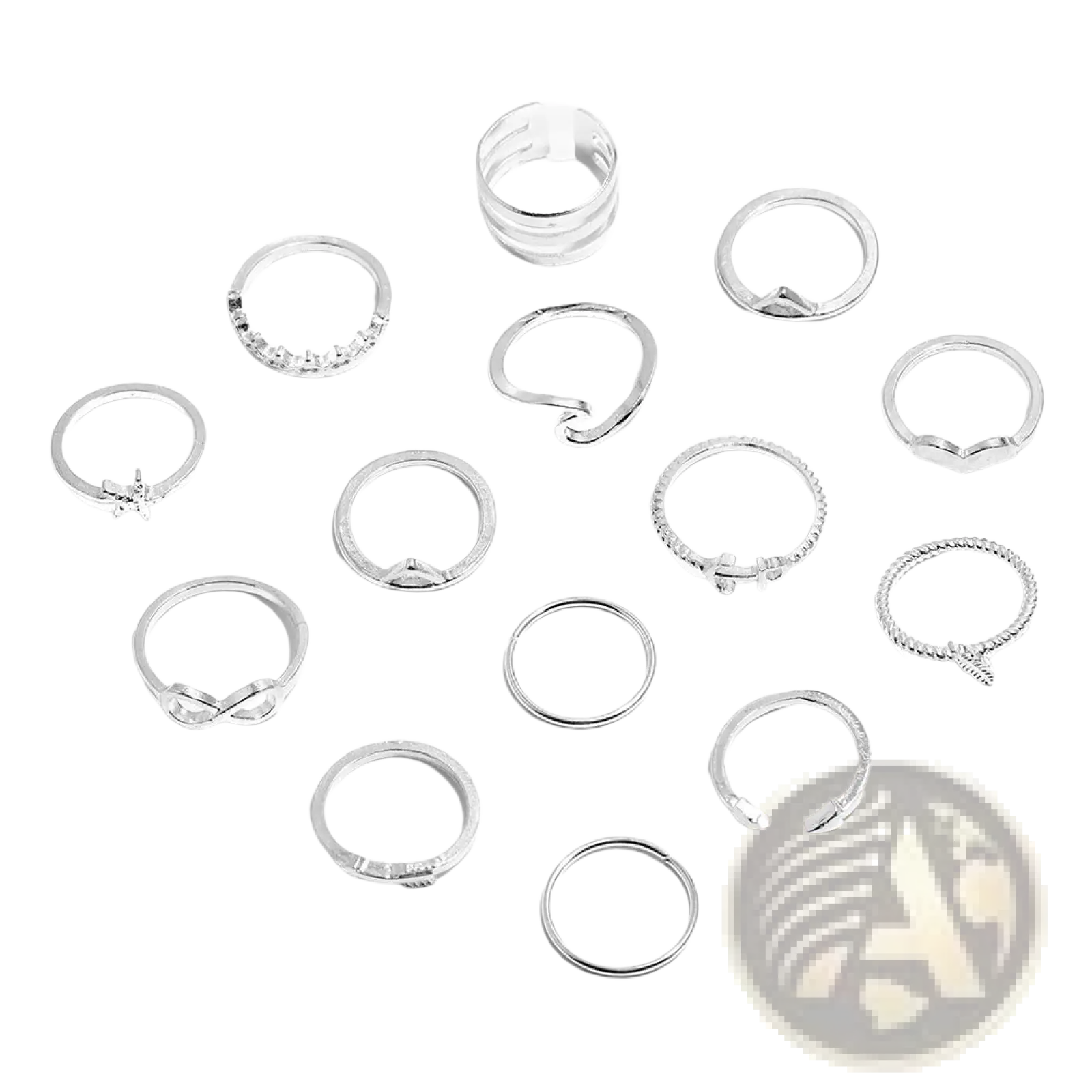A collection of silver-toned bohemian stackable rings featuring mixed motifs like beads knots stones and crosses