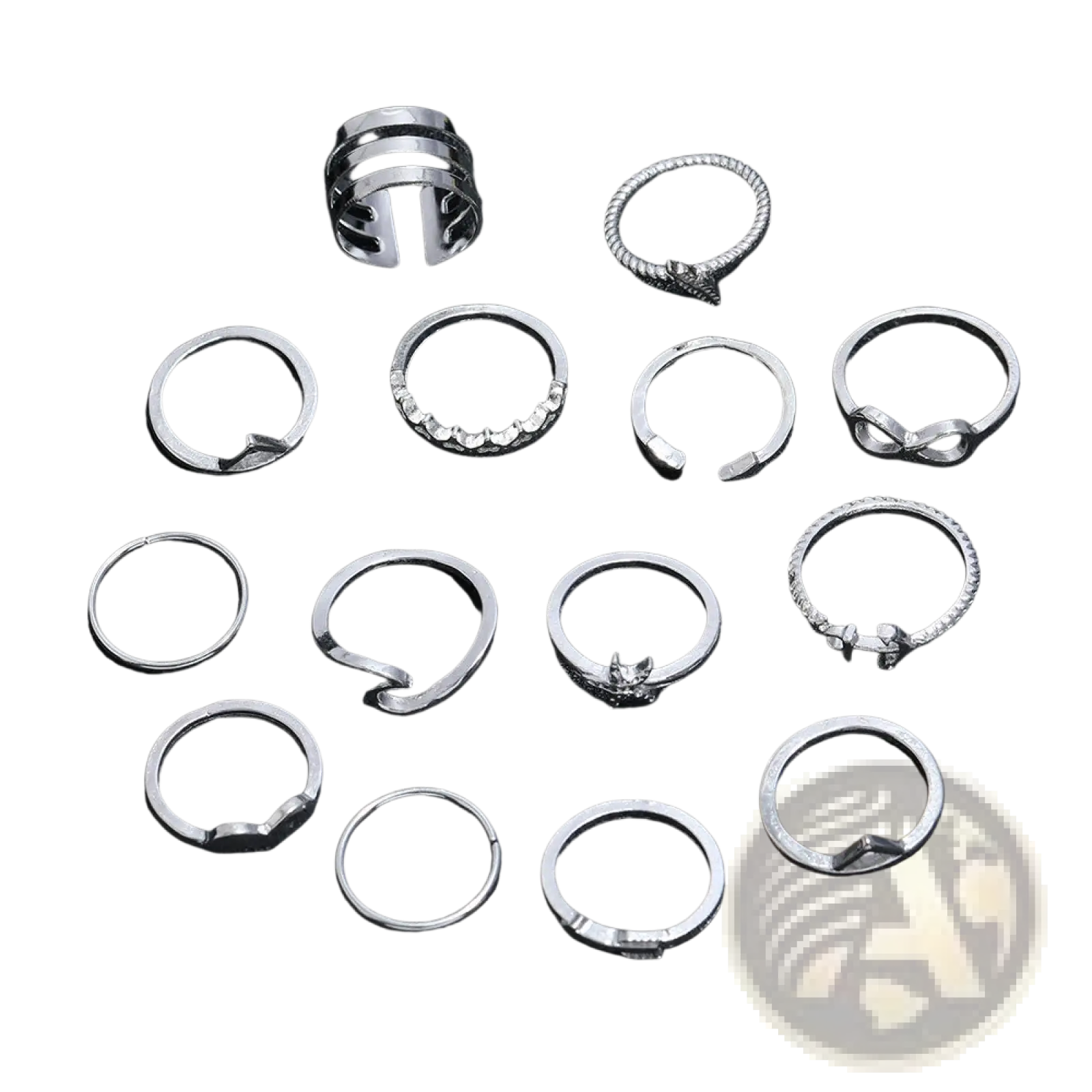 A set of silver-toned bohemian stackable rings with mixed motifs including crystals and intricate patterns