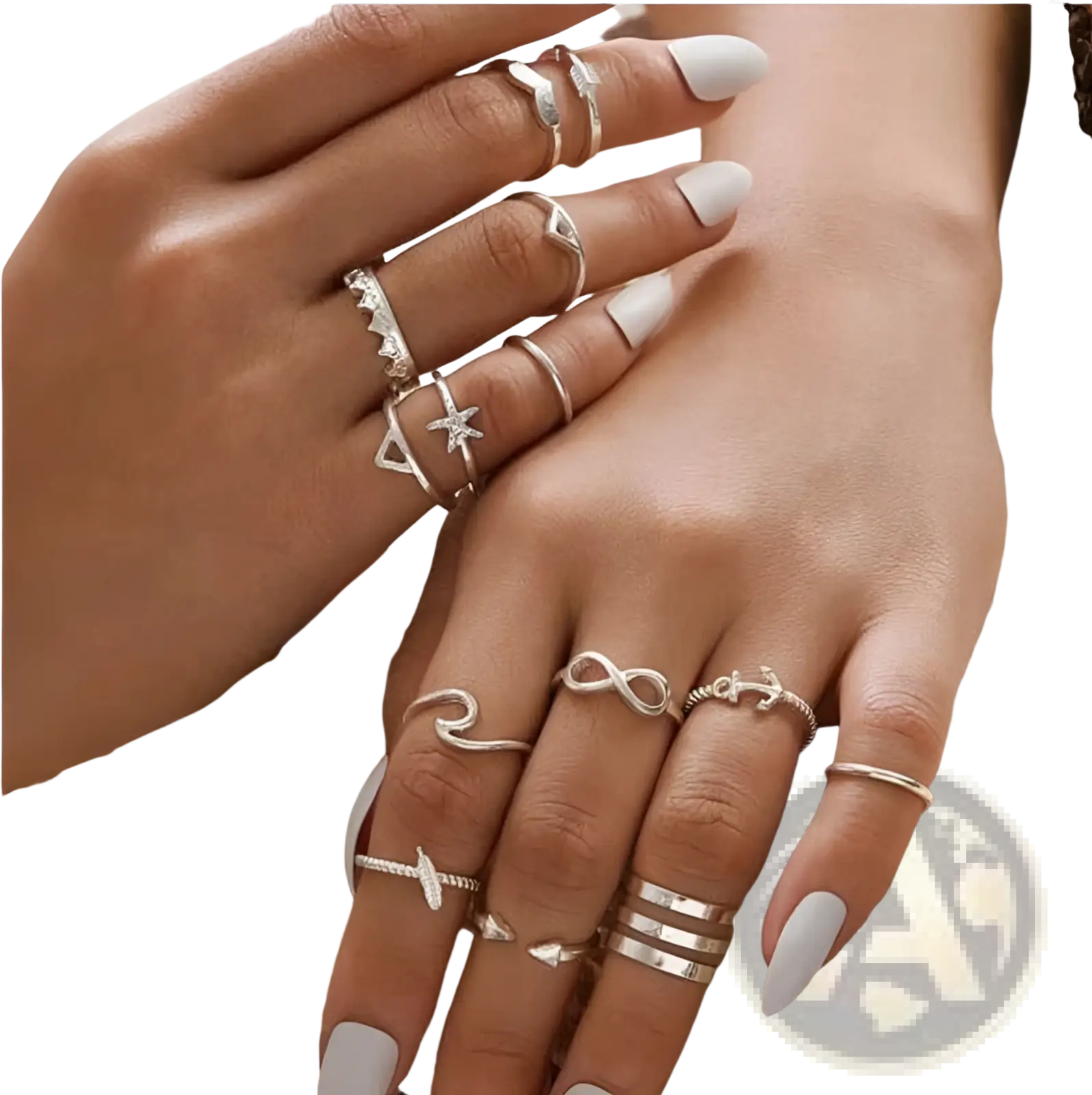 A bohemian silver mixed motif stackable ring set featuring silver-toned rings with infinity, anchor, star, and geometric designs