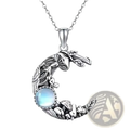 Silver crescent moon pendant necklace with intricate mushroom leaf designs and central blue moonstone gemstone