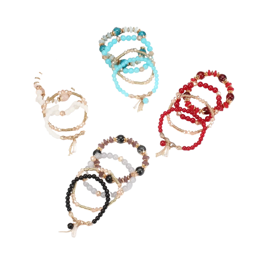 A collection of high quality bohemian stackable bead bracelets with colorful beads gold-toned accents and tassel charms