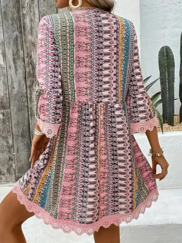 Embroidered bohemian v-neck pink long-sleeved dress with geometric floral patterns and lace trim ideal for beachwear