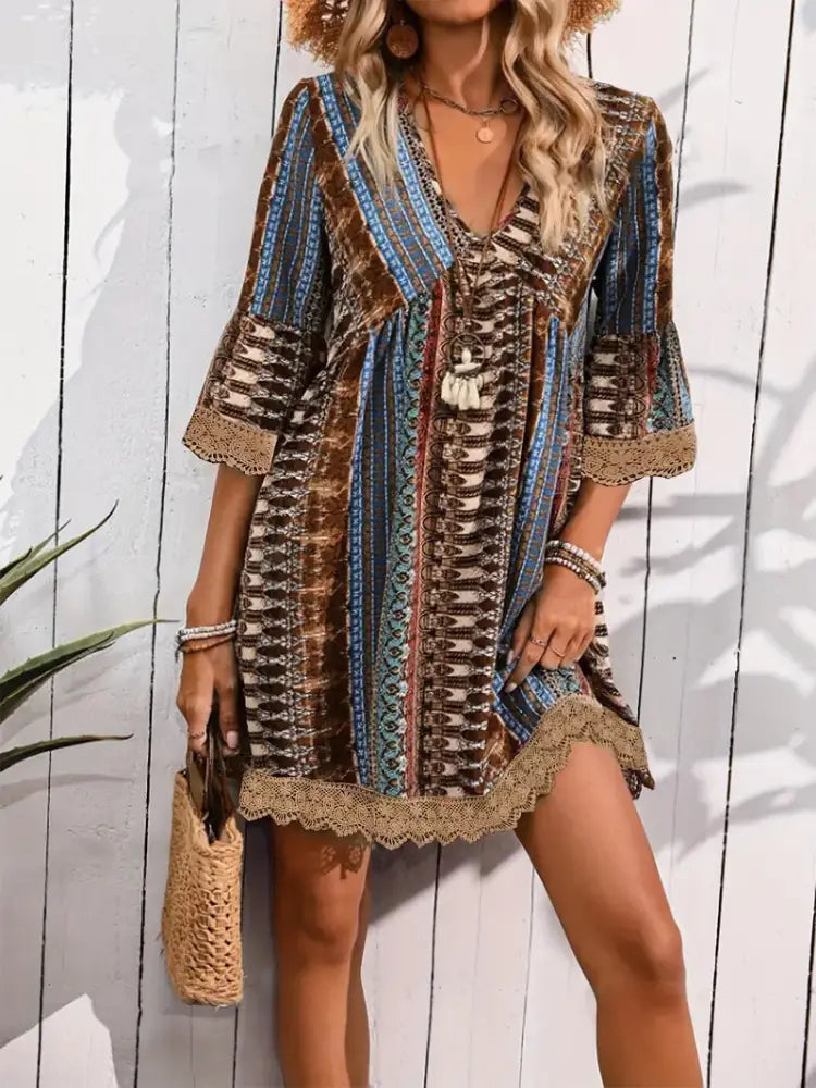 Embroidered bohemian v-neck lace trim beach dress with intricate vertical stripes in earthy brown blue and beige tones