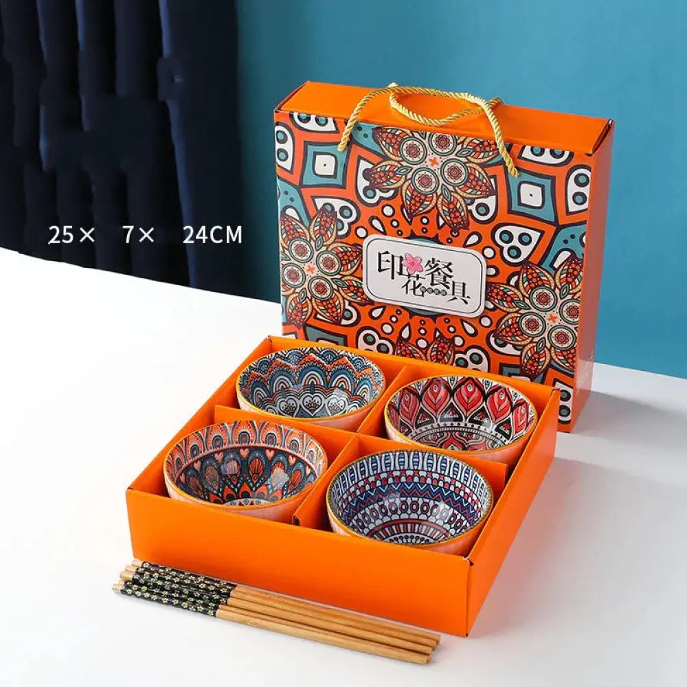 Set of four ceramic bowls with colorful mandala patterns in orange packaging for bohemian style gift set