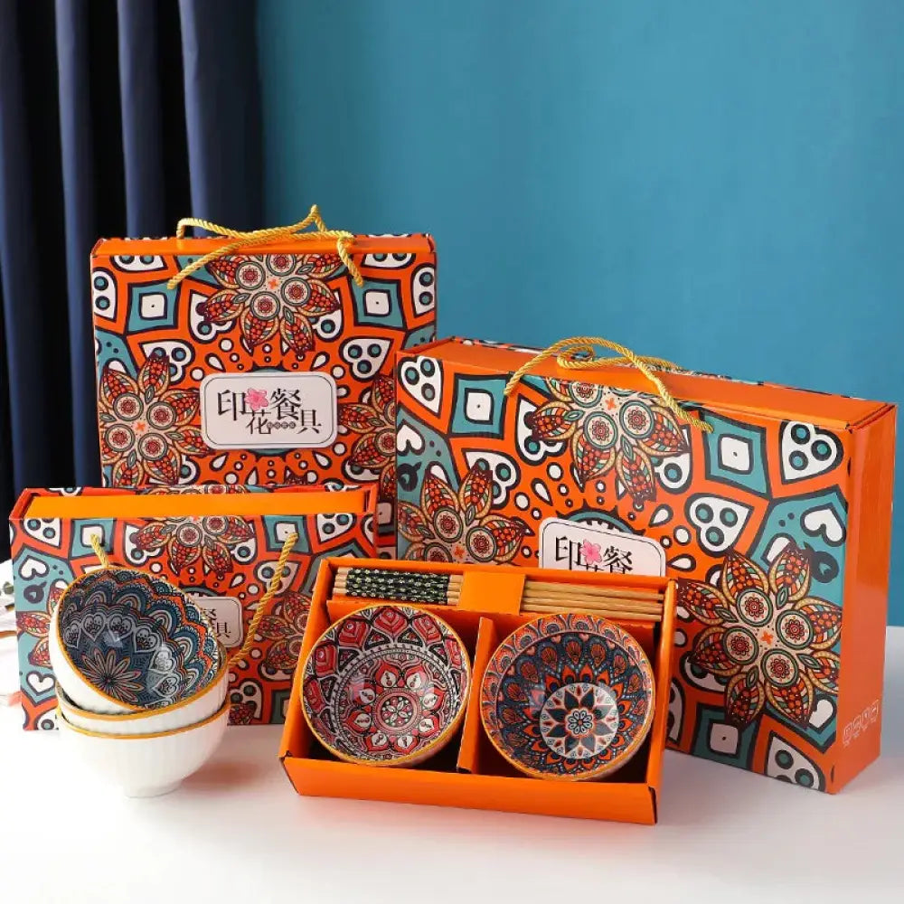 Orange gift box with intricate red teal and white floral and geometric patterns for 4-piece bohemian mandala ceramic bowl set