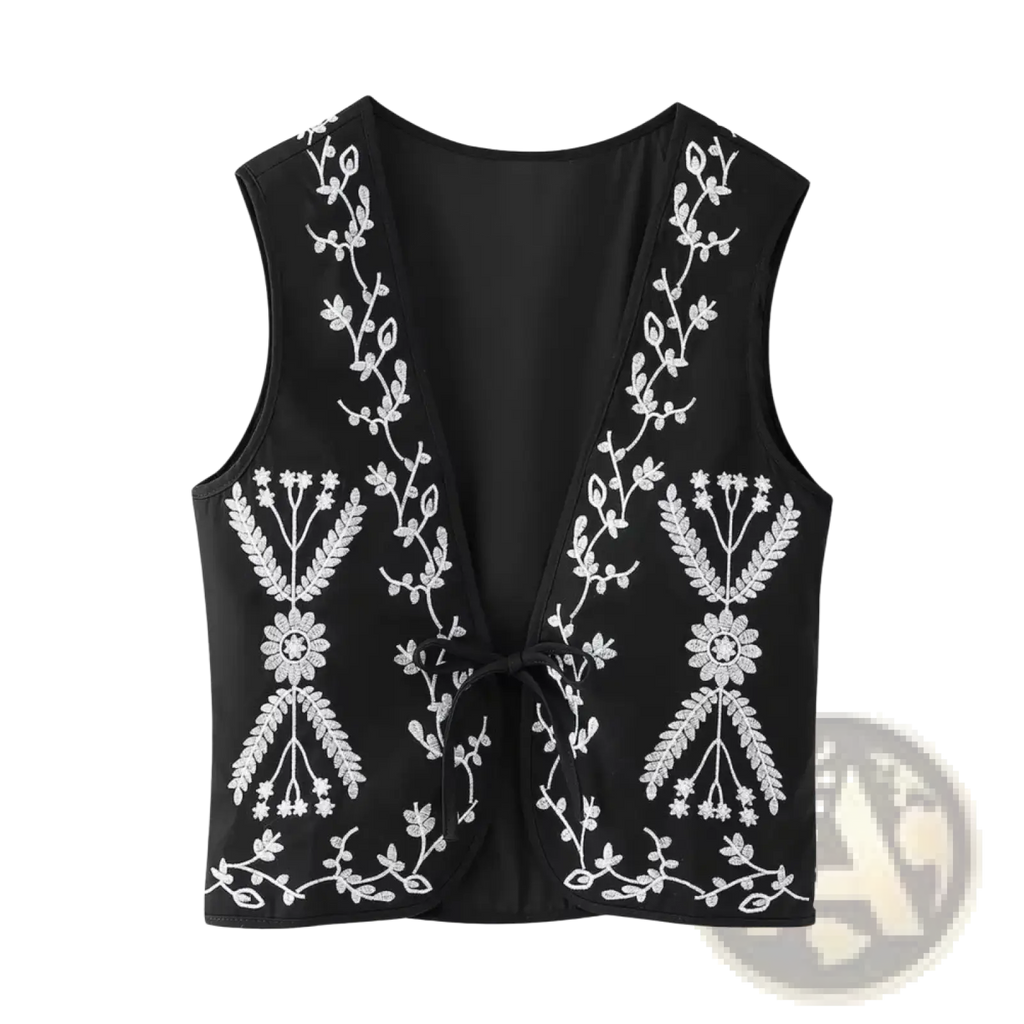Black sleeveless boho floral embroidered quilted vest with white intricate embroidery and tied waist detail
