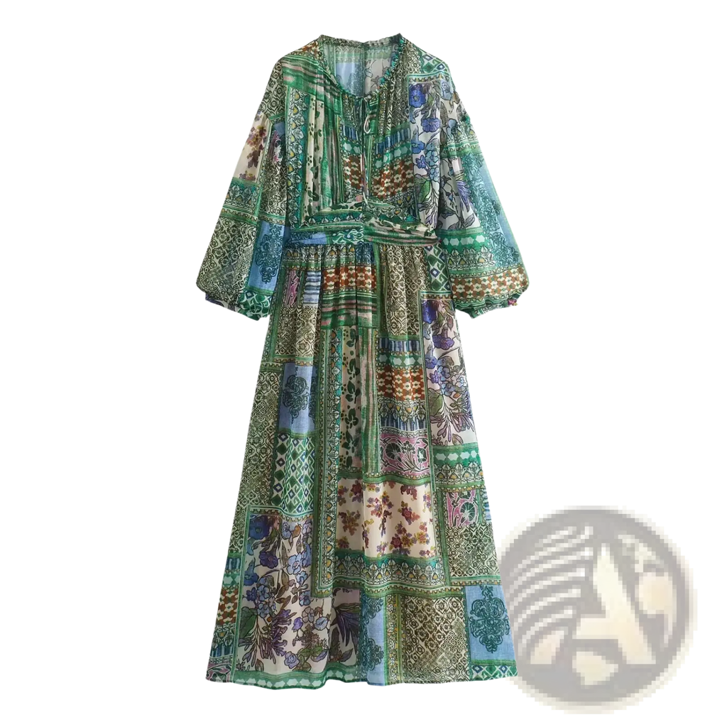 A flowing long-sleeved maxi dress with vibrant green blue floral patchwork on lightweight chiffon fabric
