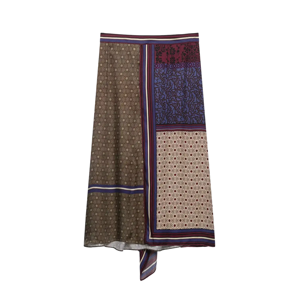 A boho geometric print two piece skirt set featuring a patchwork midi skirt with earthy geometric patterns