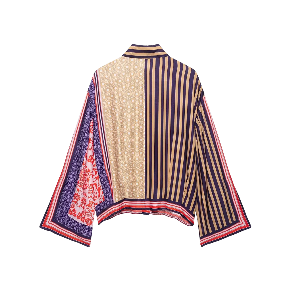 A boho geometric print two piece skirt set with a stylish oversized blouse featuring bold patchwork in navy beige red and cream