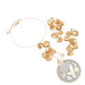 Boho gold ginkgo leaf tassel necklace and earrings set with gold-toned layered petal designs and delicate details