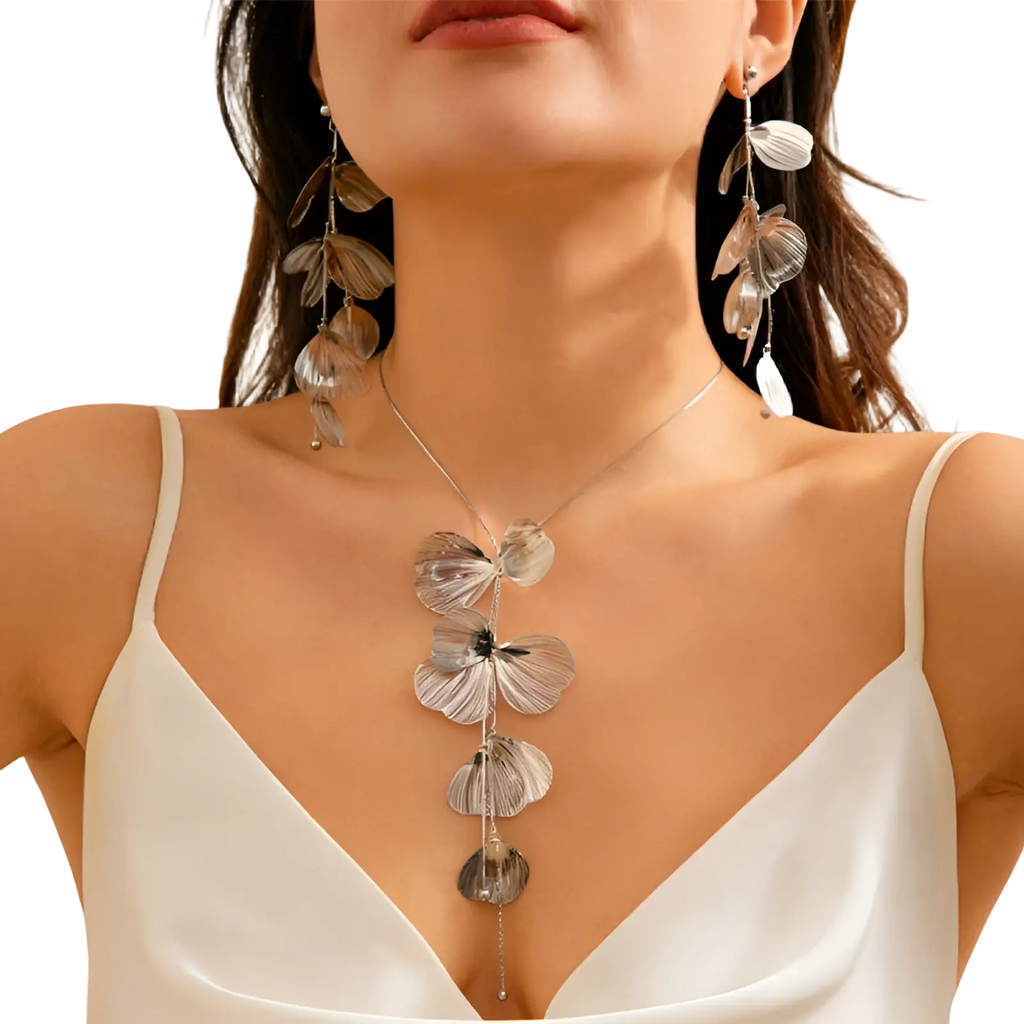 Silver leaf pendant necklace with delicate layered petal designs in boho gold ginkgo leaf tassel necklace and earring set