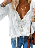 White lace blouse with a v-neckline and long sleeves made of delicate lace fabric for a boho chic look