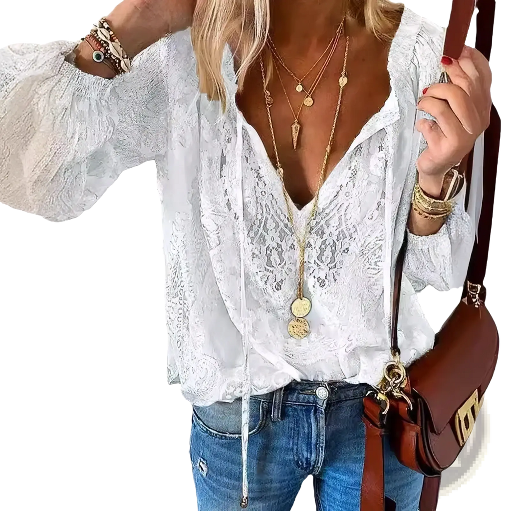 White lace blouse with long sleeves and deep v-neckline in boho style made of delicate lace fabric