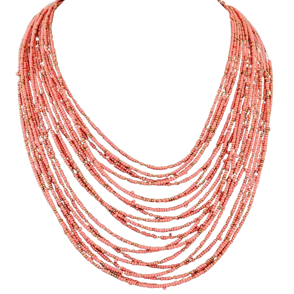 Boho multi-layer bead statement necklace featuring coral beads and subtle gold accents on black mannequin bust