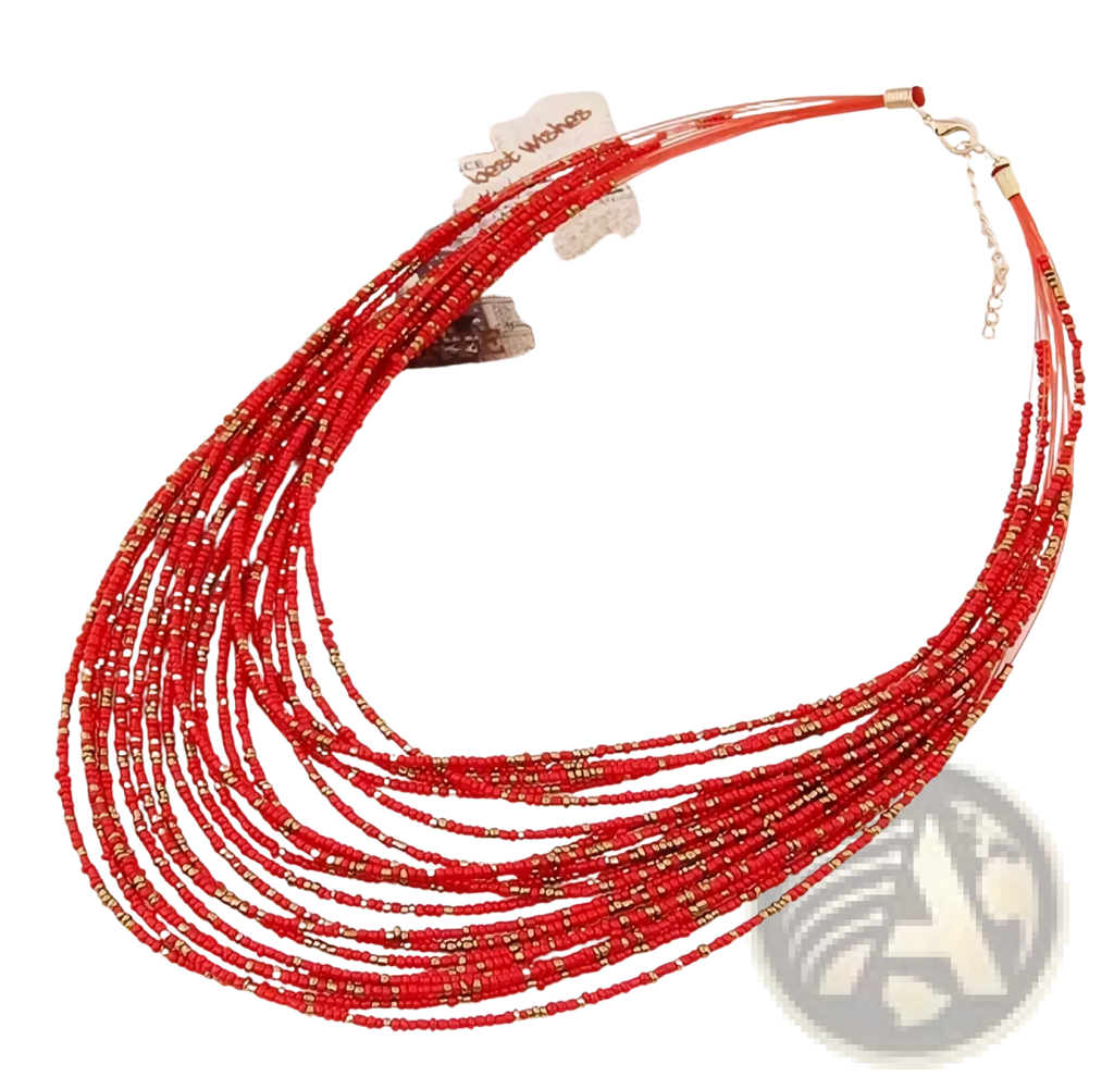 A boho multi-layer bead statement necklace featuring vibrant red beads with gold accents and a delicate chain clasp