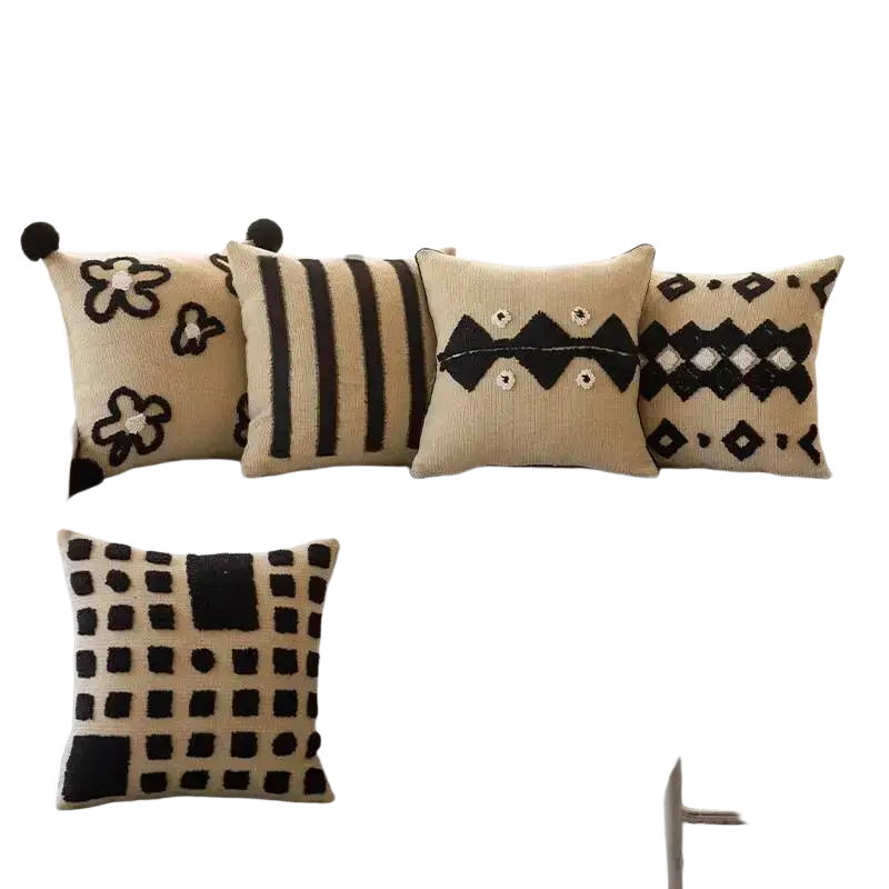 Set of five beige and black textured boho throw pillow covers with embroidered geometric and floral patterns for living room decor