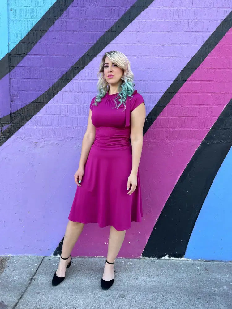 Magenta ruched a-line bombshell dress with pockets in vibrant fuchsia featuring a fitted bodice and flared skirt
