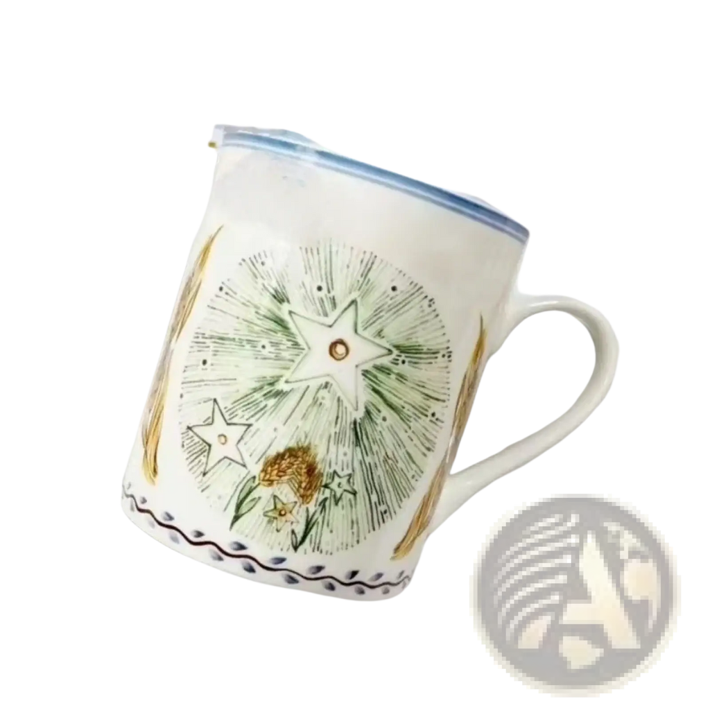 Bone china coffee mug with a white ceramic body hand-painted with green and gold floral stars and wheat design with blue rim