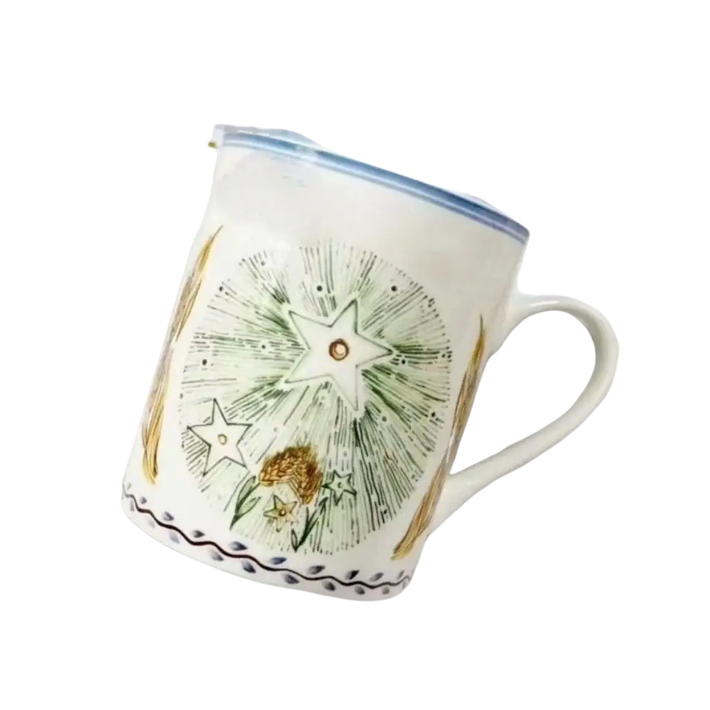 Bone china coffee mug with a white ceramic body hand-painted with green and gold floral stars and wheat design with blue rim