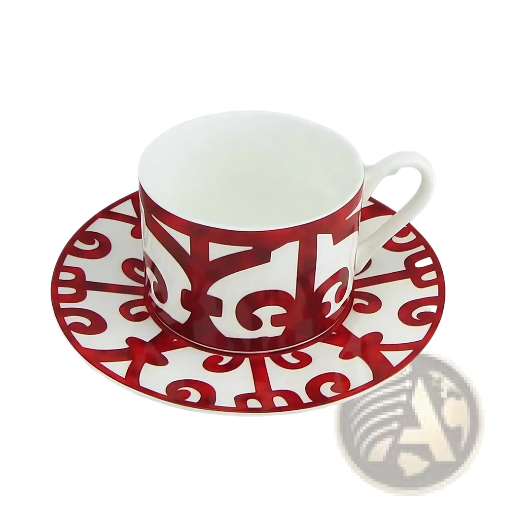 White porcelain bone china teacup and saucer set with bold red ornamental scrollwork from red scroll dinnerware set