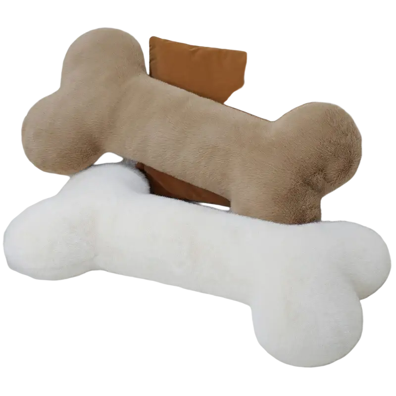 Two kawaii bone shape plush pillows in beige and white with soft fuzzy texture as a soft nap cushion