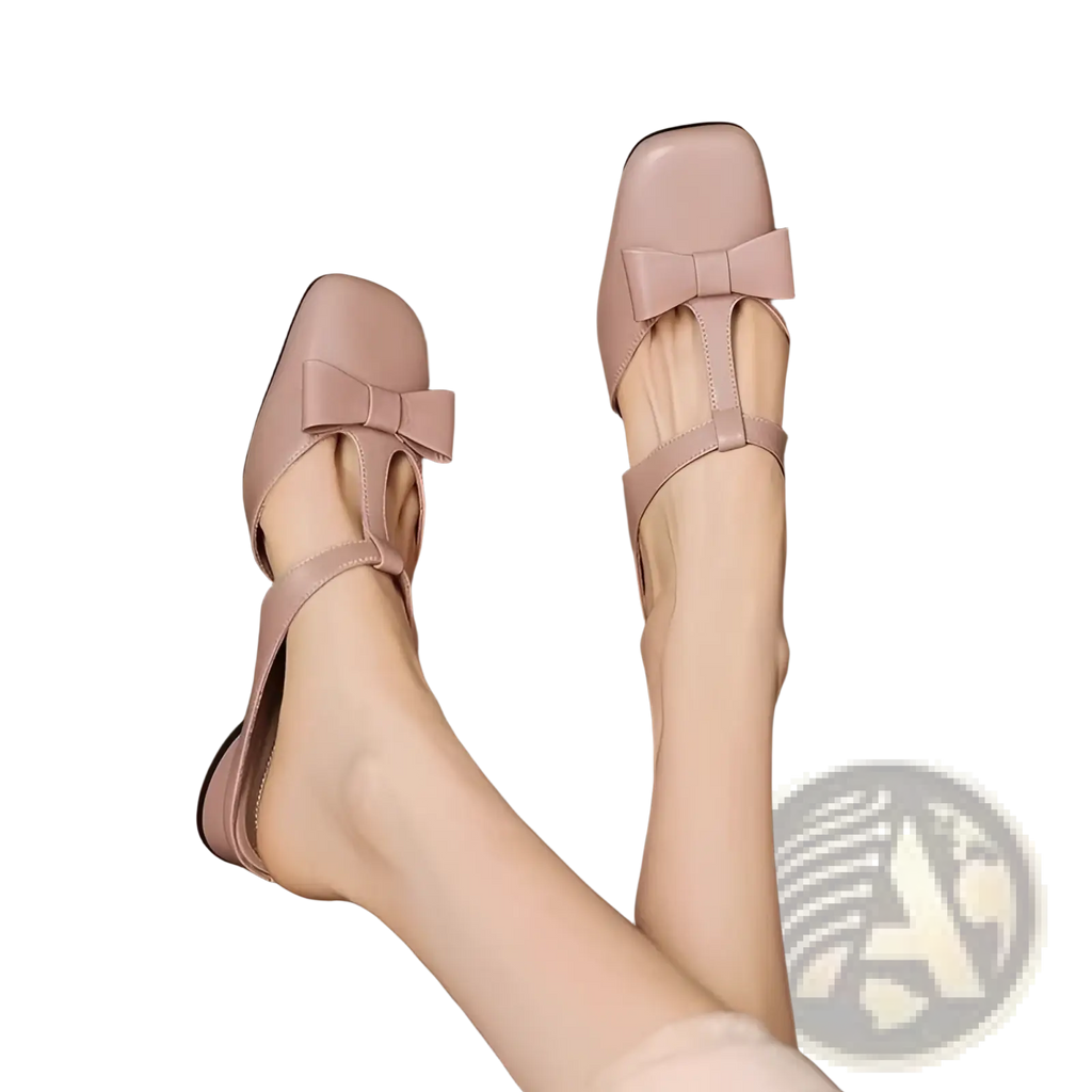 Pink leather closed toe mule flats for women with a square toe and bow detail on the vamp