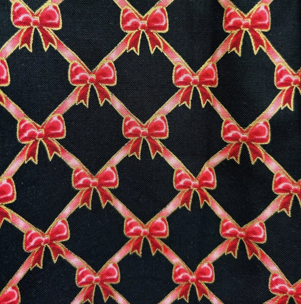 Black cotton retro bow print a-line dress with peter pan collar featuring red bows with gold outlines in lattice design