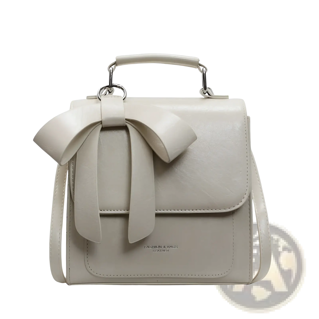 A sleek off-white faux leather bow crossbody bag with silver-toned hardware and a prominent front bow detail
