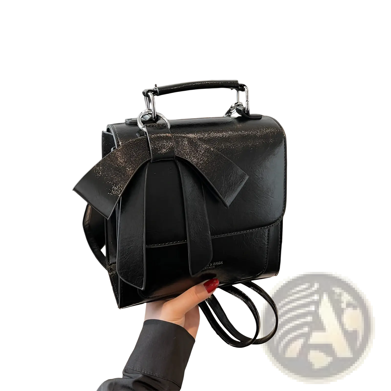 Black faux leather bow crossbody bag with glittery bow and silver toned hardware for fashionable use