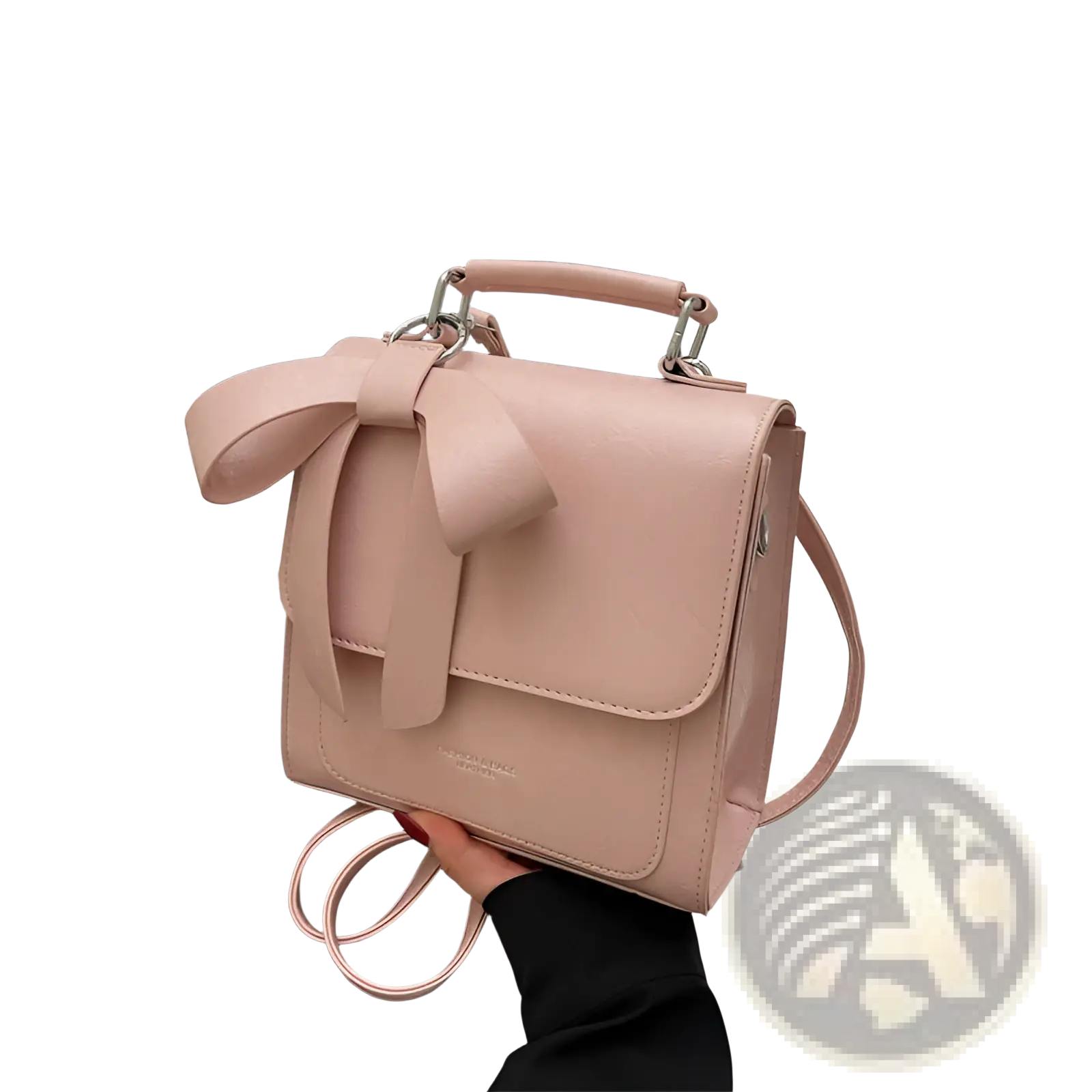 A soft pink faux leather bow crossbody bag with silver-toned hardware perfect for fashion handbag use
