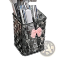 Transparent black woven plastic makeup brush holder with pink bow accent for desktop storage organizer