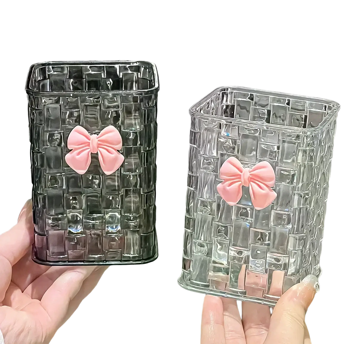 Transparent glass rectangular pen holder with woven texture and pink bow accents for desktop storage organizer