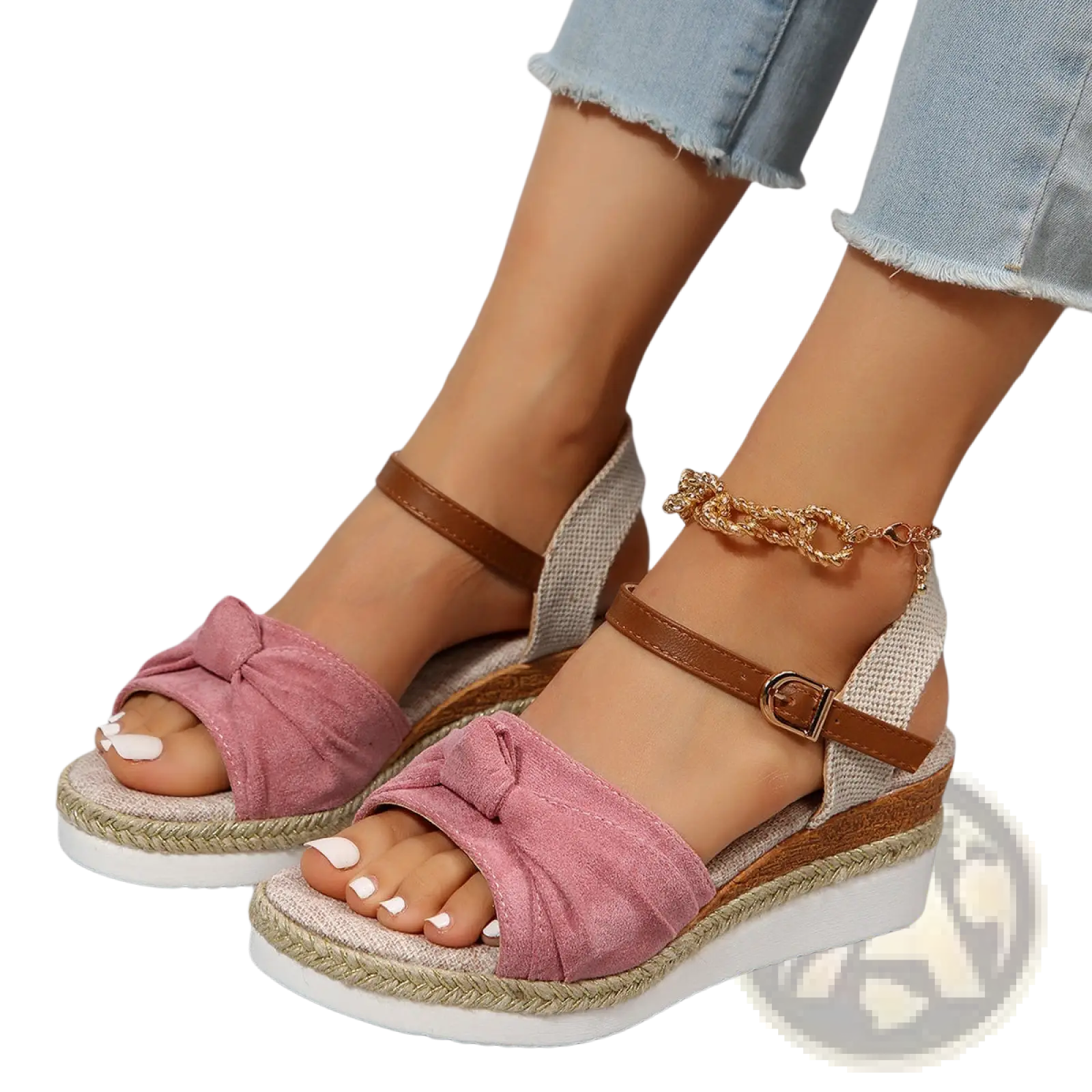 Pink suede bow-adorned wedge sandals with brown leather buckle straps and woven espadrille rope sole front view